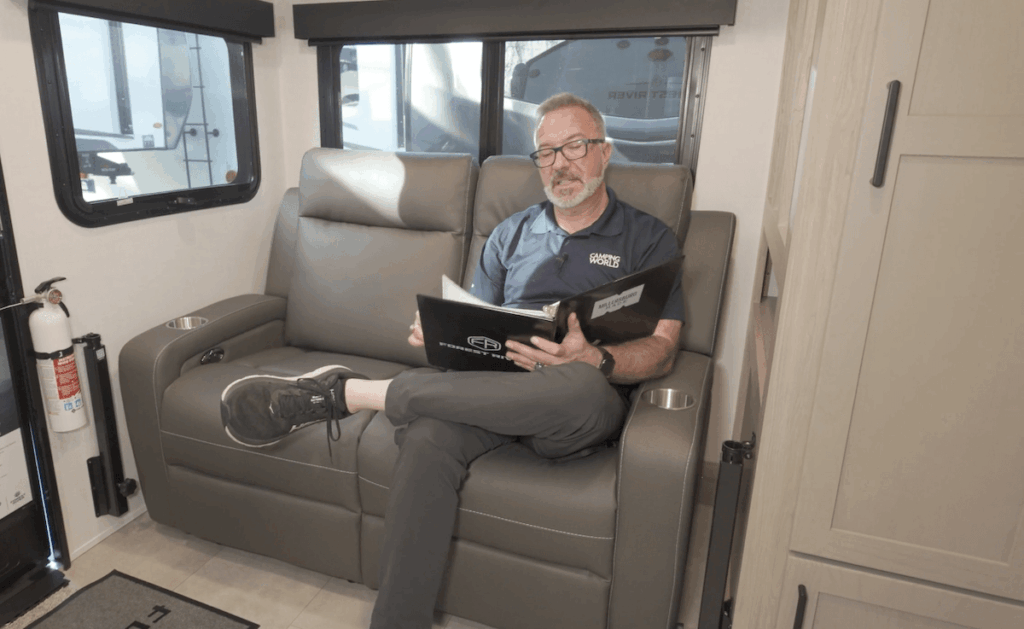 Man reading RV owner's manual