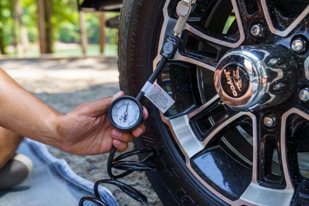 Tire gauge reading air pressure basic RV maintenance tips