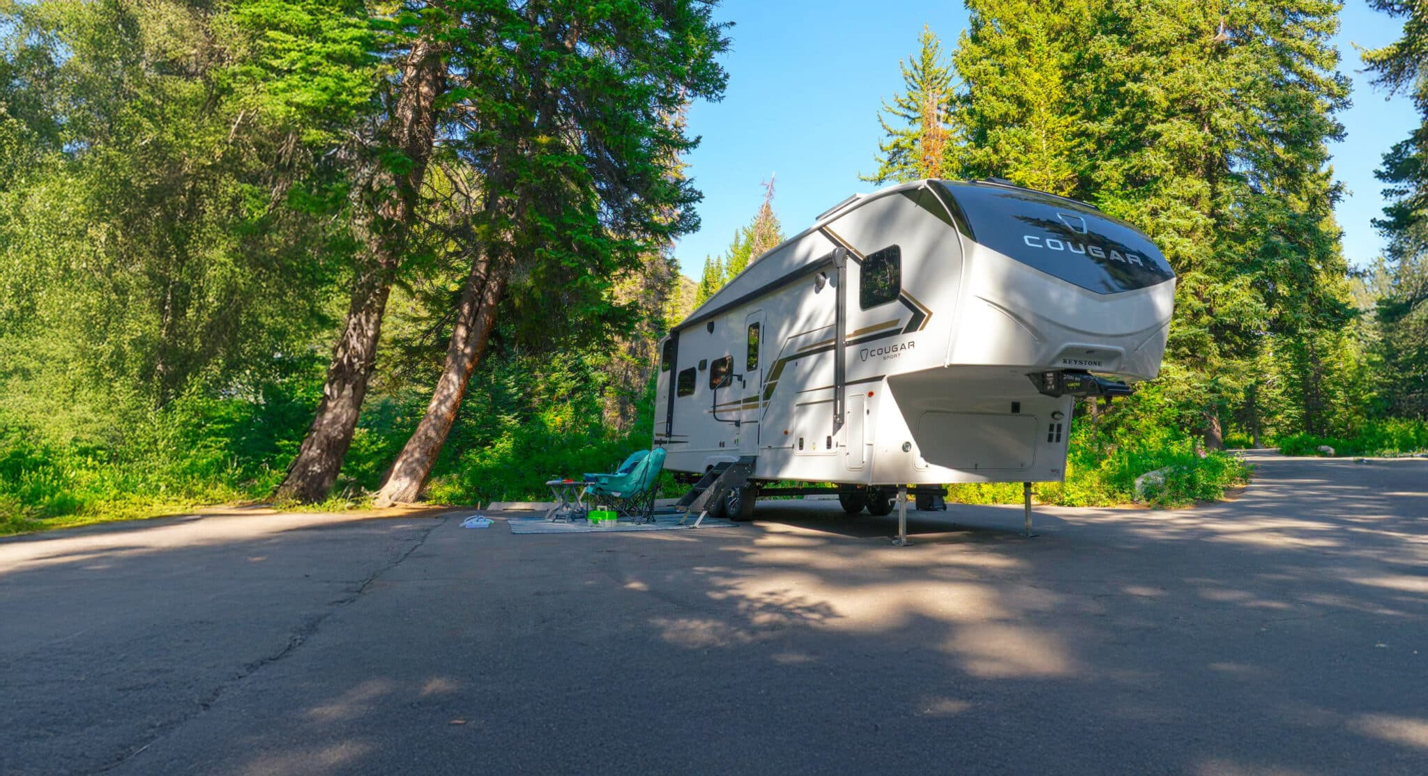 Cougar Sport 2700BH fifth wheel in parking lot