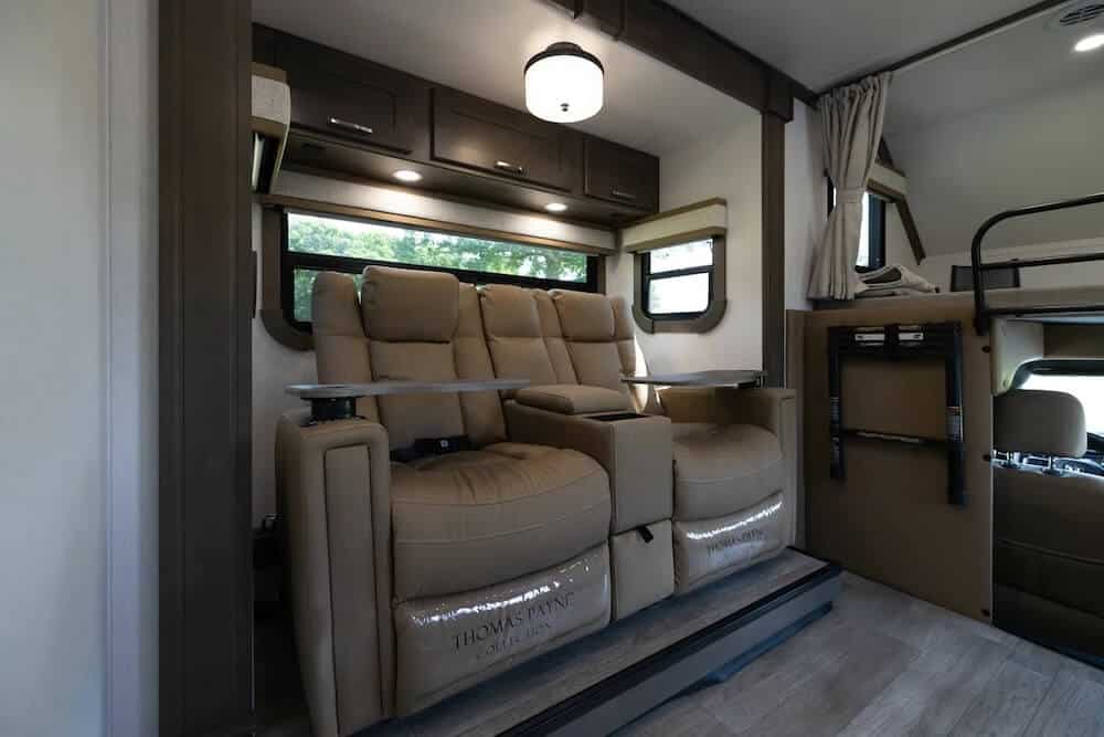 Dynamax-Isata-5-28SS-Theater-sofa-slide-Image-by-Dynamax What Are the Best Super C RVs?