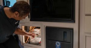 Woman checking RV furnace