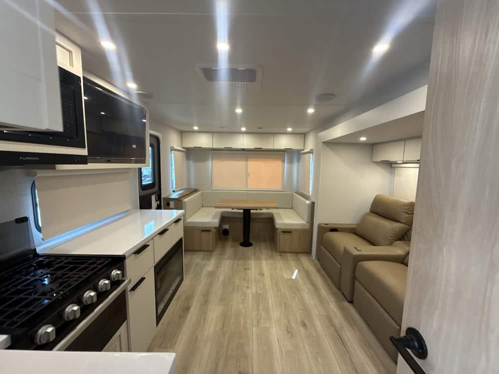 2026_winnebago_thrive_25rls-living-area-and-kitchen-Images-by-Camping-World Why a Rear Dinette Travel Trailer?