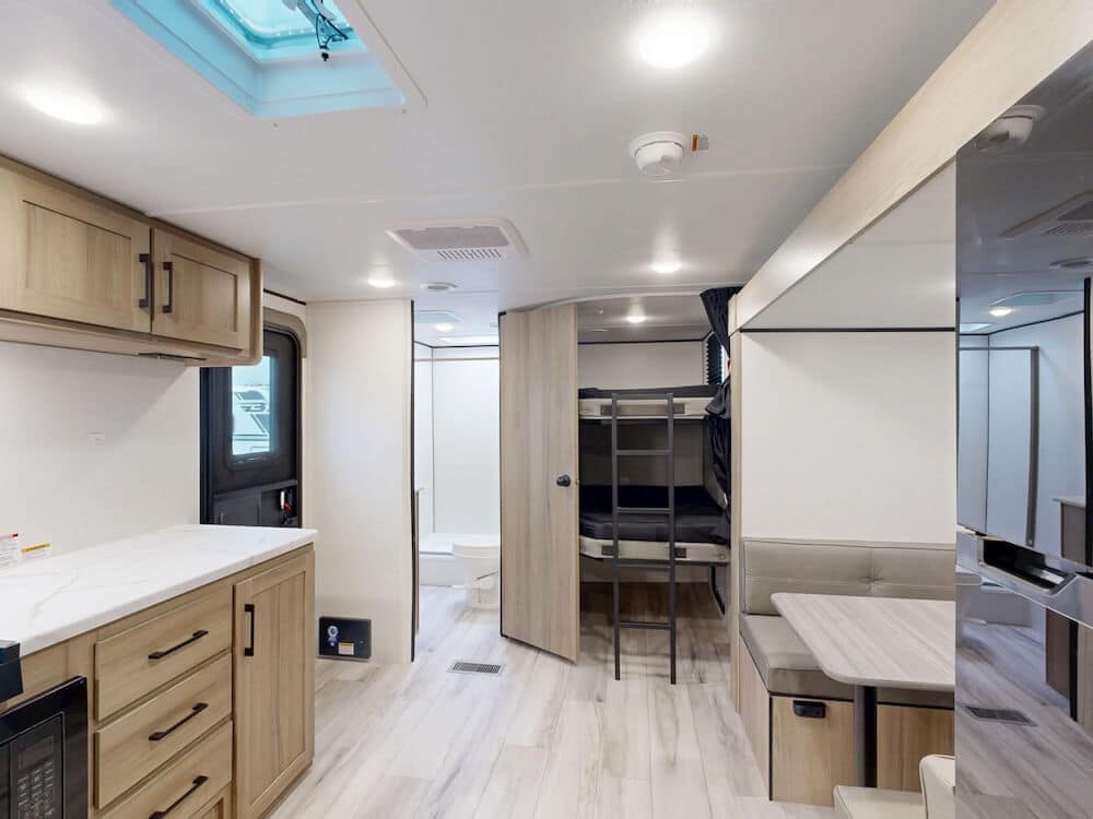 Keystone-Coleman-Lite-22BX-2025-wideinteriorliving best bunkhouse travel trailer