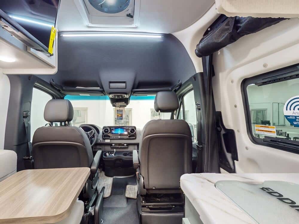 Interior cockpit and rear living area of a Thor Eddie Bauer 19EB class B RV