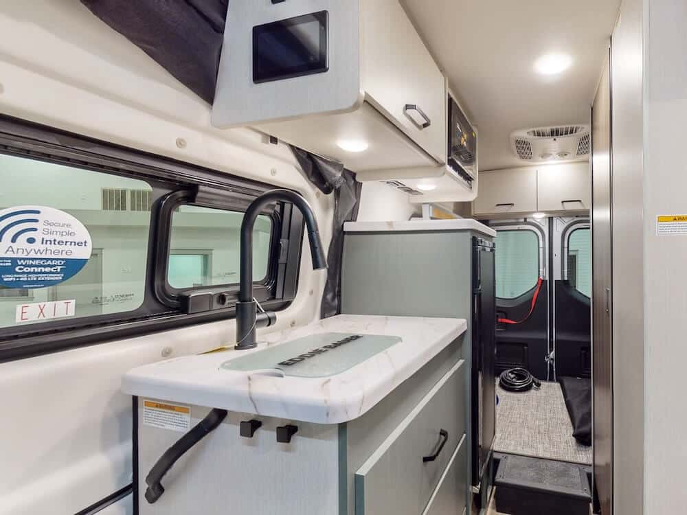 Interior kitchen of a Thor Eddie Bauer 19EB class B RV.