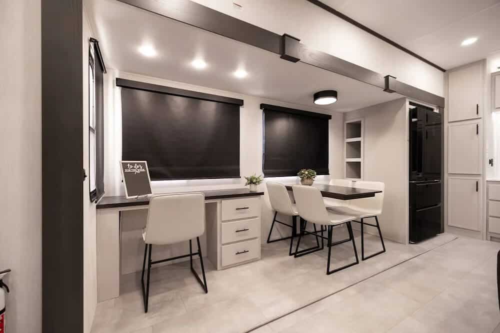 Desk and dining table of the Crusader 38BONUS fifth wheel
