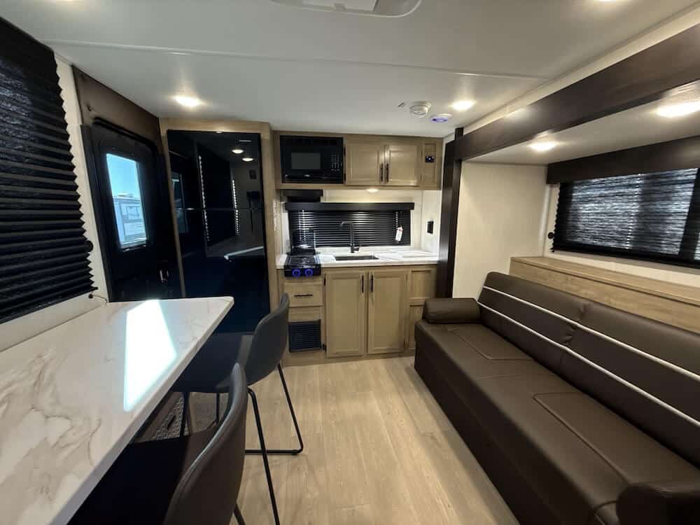 Wolf Pup 17SC living room and front kitchen RV