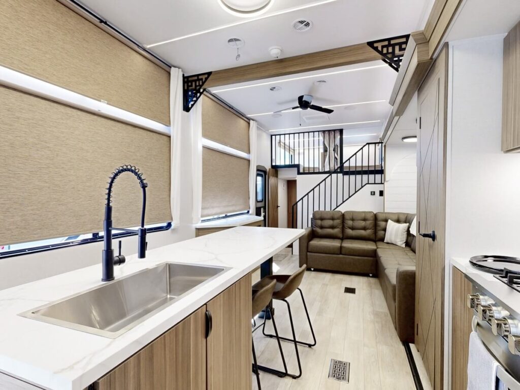 Interior image of Salem Grand Villa 42ICE showing the kitchen island and sectional sofa.