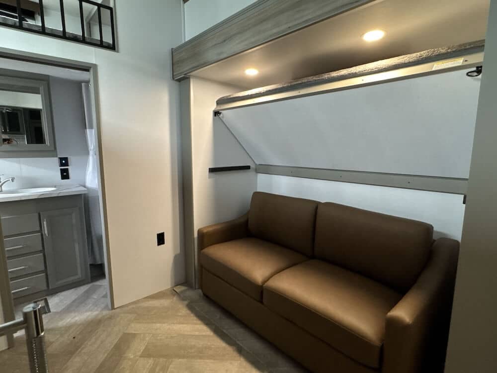 Sprinter 3900DBL interior showing couch with fold down bunk.