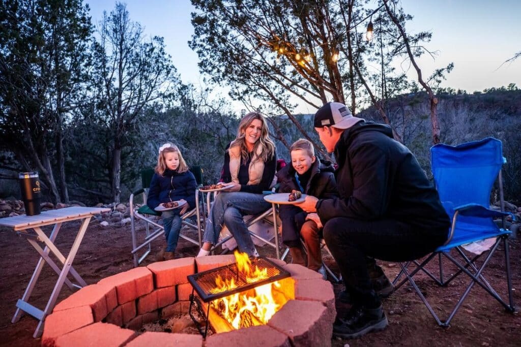 Family eating around the campfire