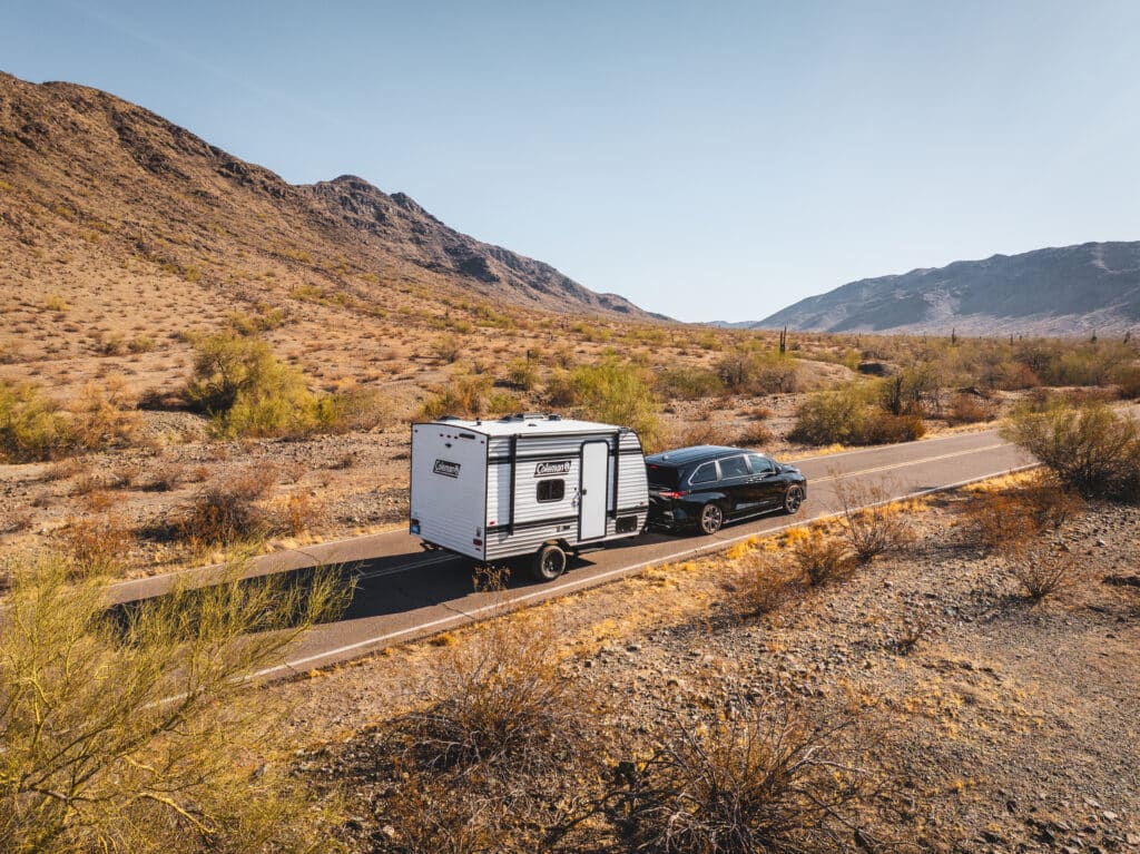 SUV towing small Coleman camper