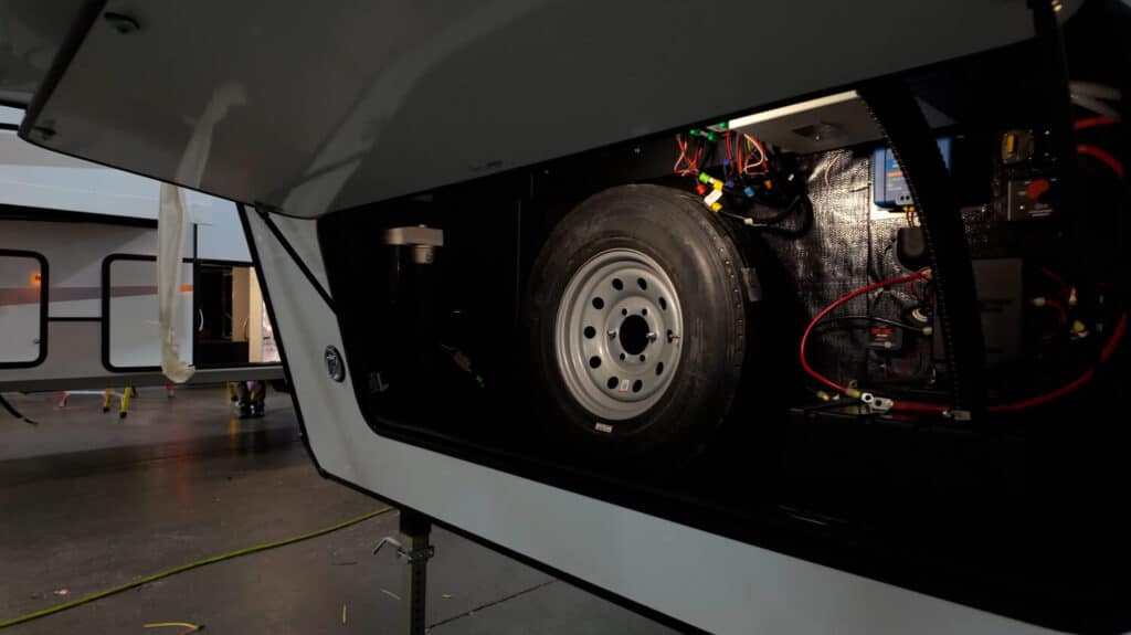 Utilities inside fifth wheel front compartment