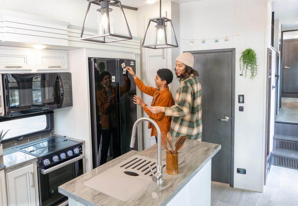 Parent and child wondering why RV refrigerator is not working