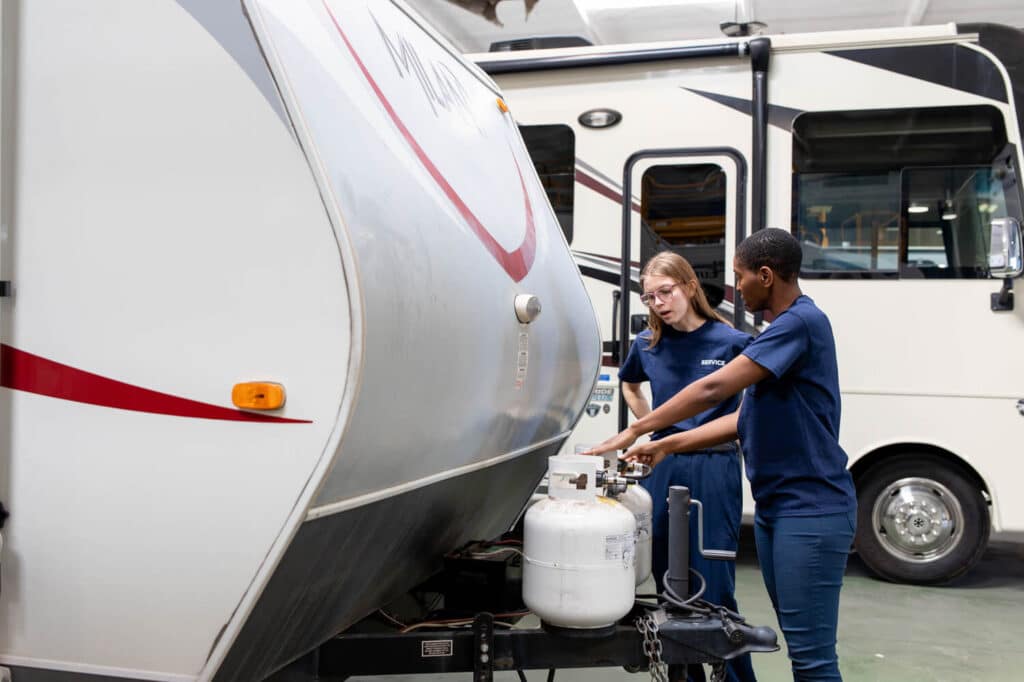 Technicians inspecting LP containers