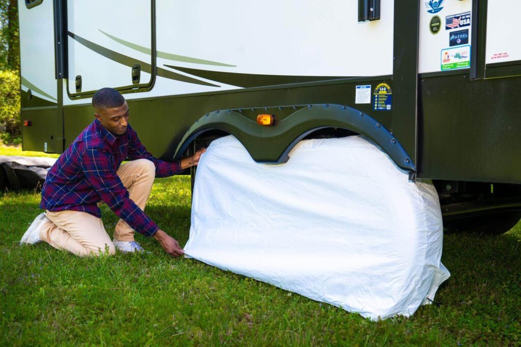 Man installing RV tire covers