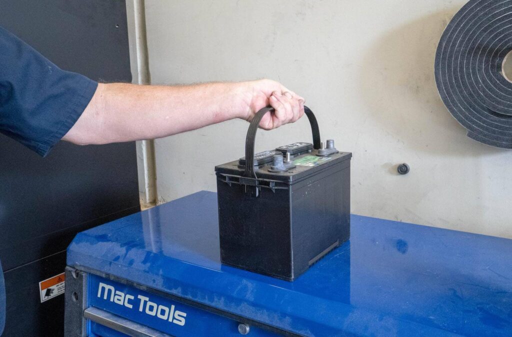Removing a battery to charge an RV battery