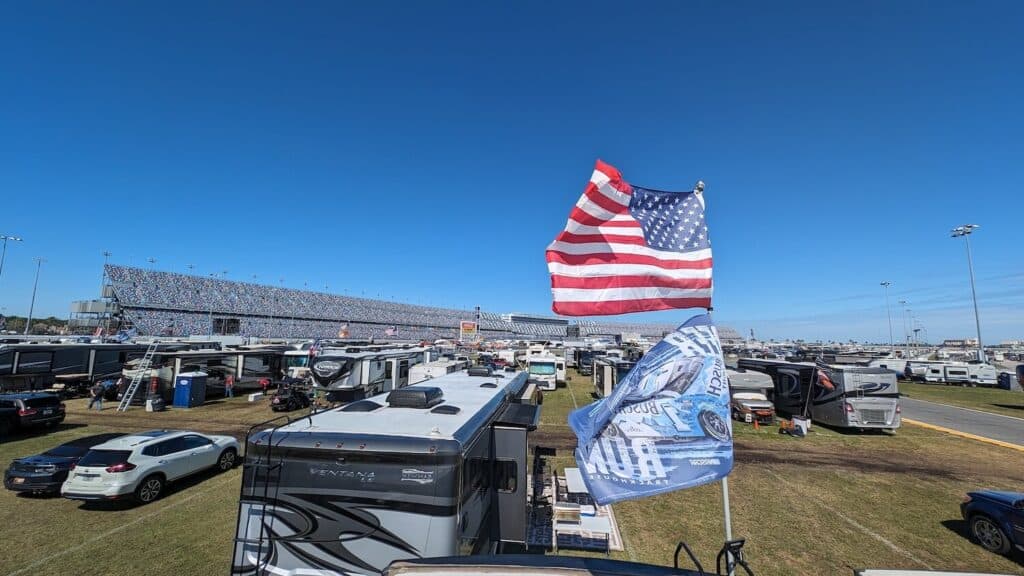 Daytona 2024 infield camping with flags in the foreground