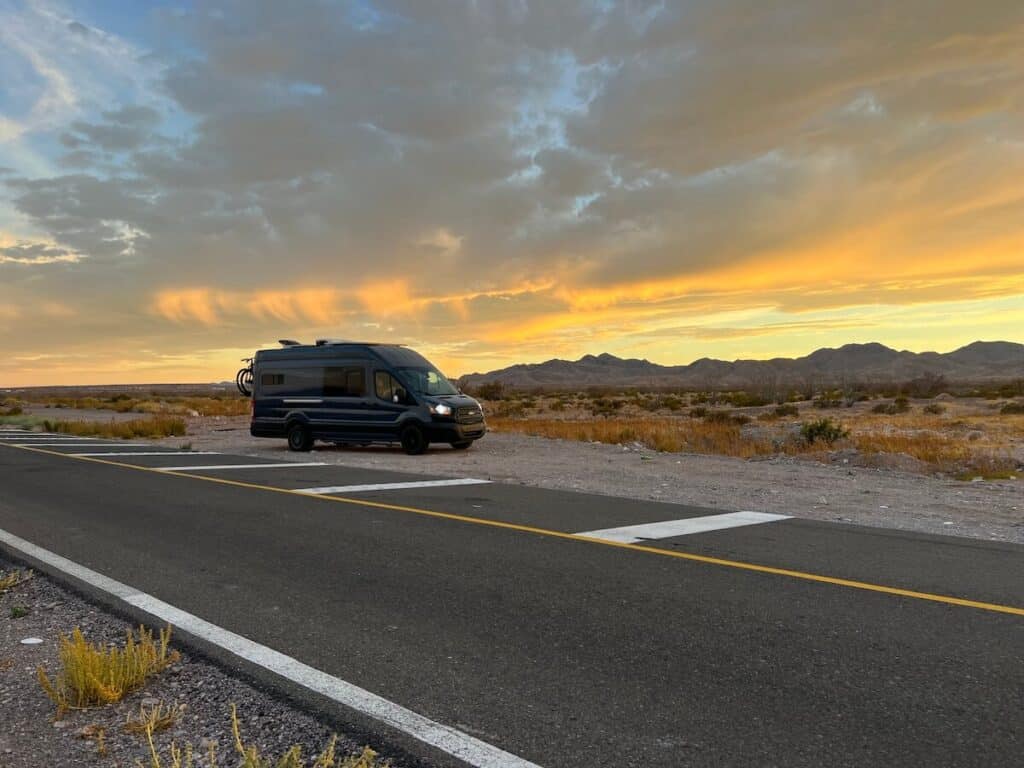 Manny and Hope's camper van with a beautiful sunset