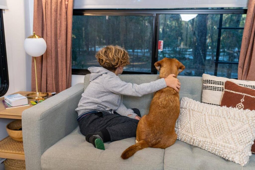 Kid with pet in RV