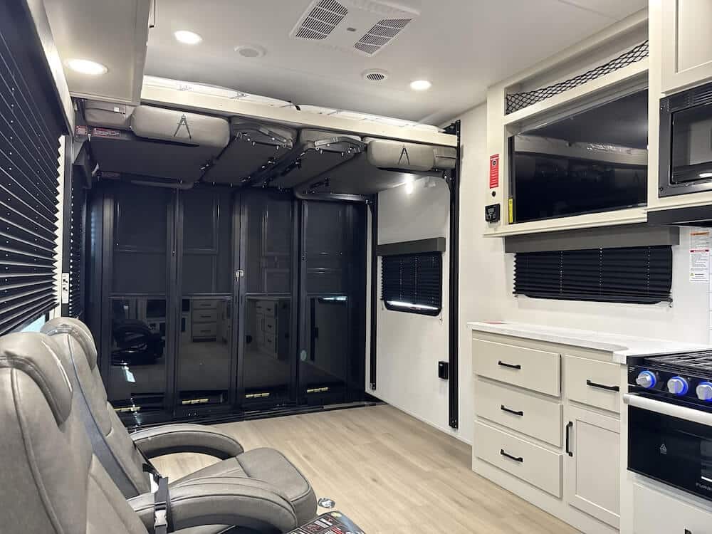 2026_grand_design_momentum_g_class_27g_rv819108_impel-capture_close-up_wide-interior-living best toy hauler rv for families