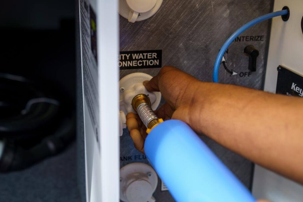 RV city water connection with check valve as RV safety equipment