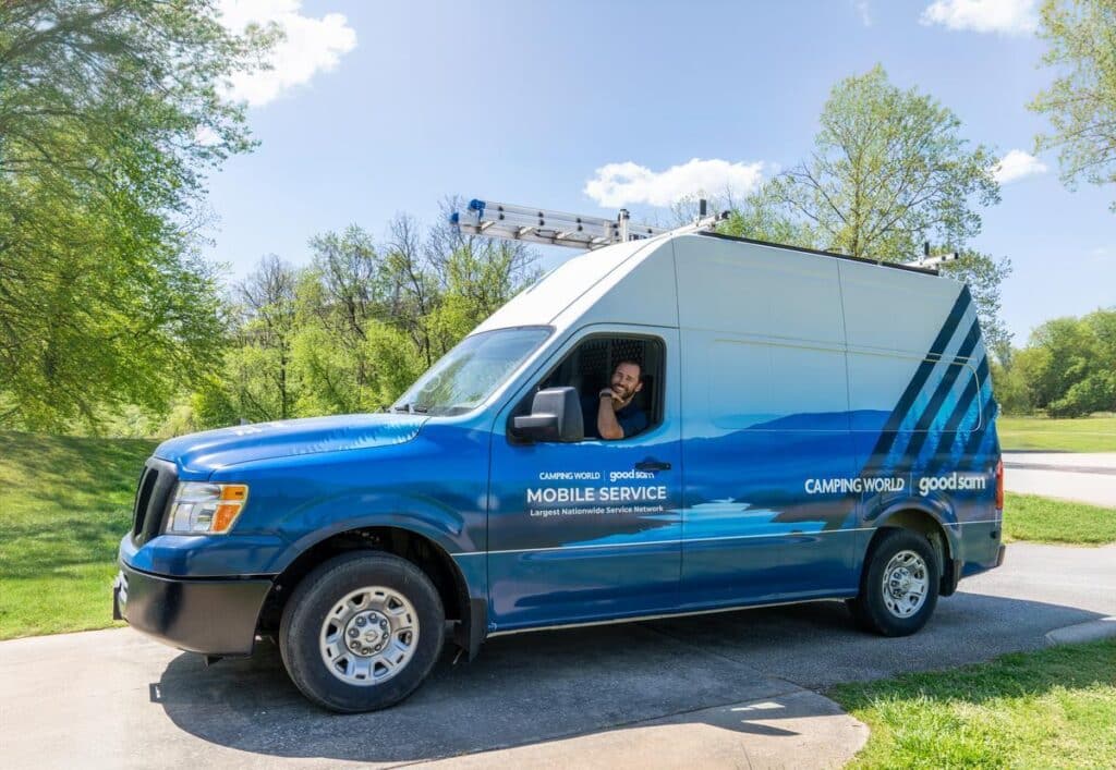 Mobile service tech pulling up to RV in a van