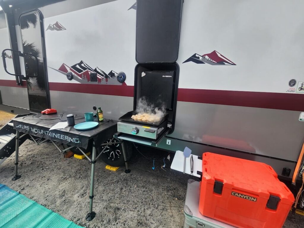 outdoor kitchen of campsite ultra travel trailer