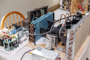 rv air conditioner with shroud removed to expose ac capacitor and other components