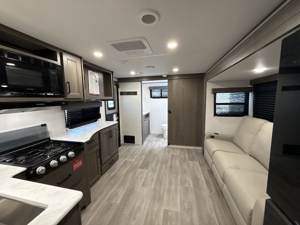 2026_grand_design_transcend_xplor_22rbx kitchen and living room back