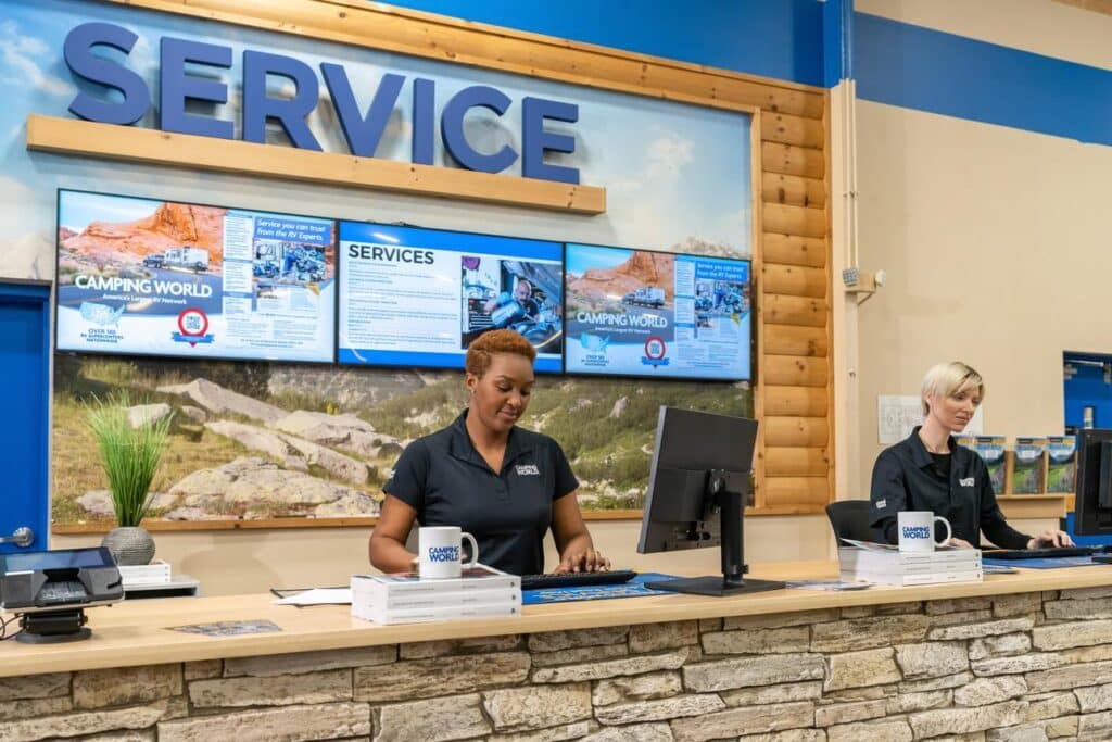 Camping World RV Service Center with female service advisors behind the counter