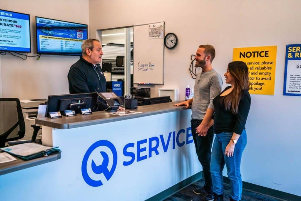 Couple asking service advisor about having their camper winterized